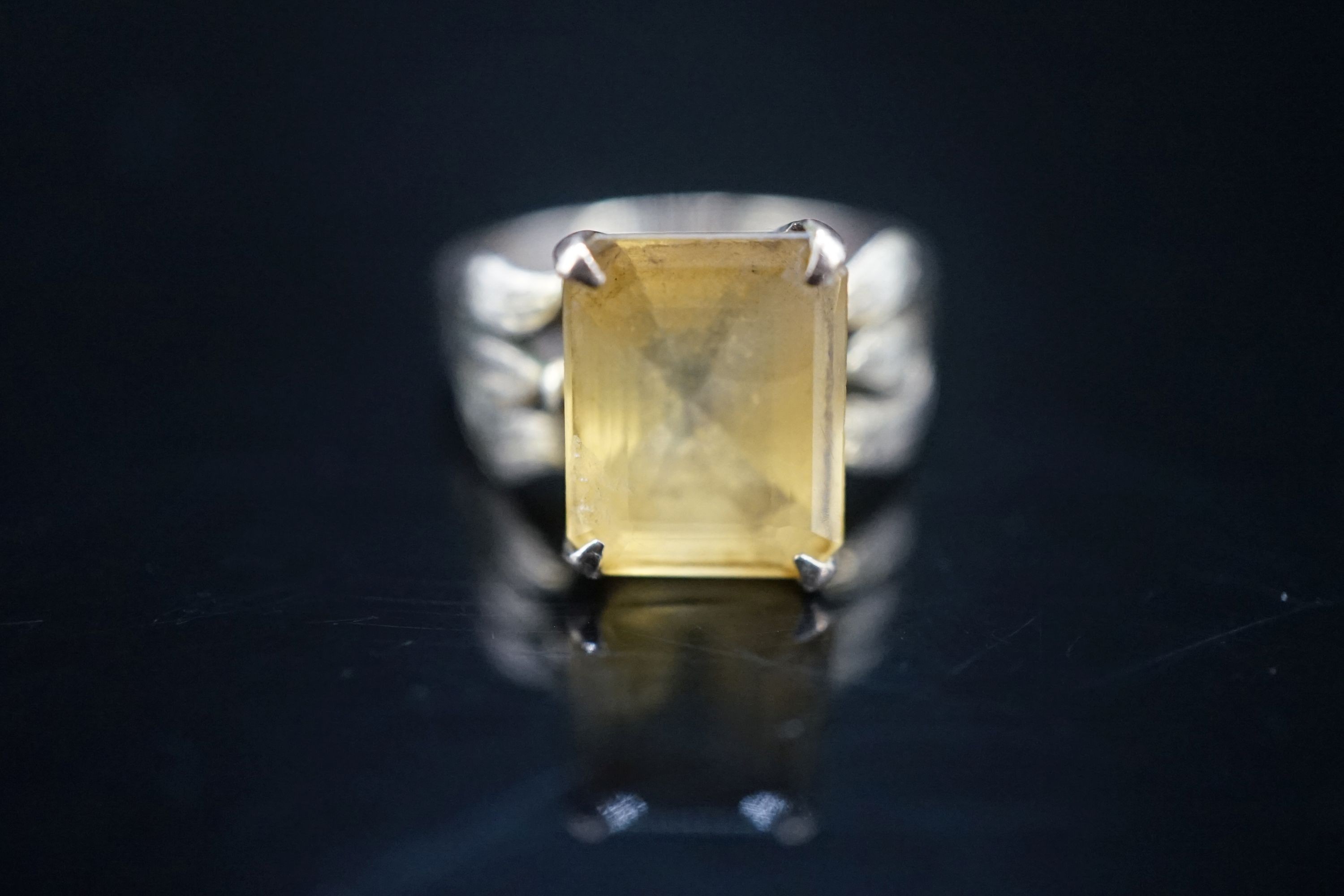 A 14k yellow metal and citrine set dress ring, size M, gross 4.9 grams.